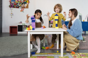 full shot kids playing with wooden shapes